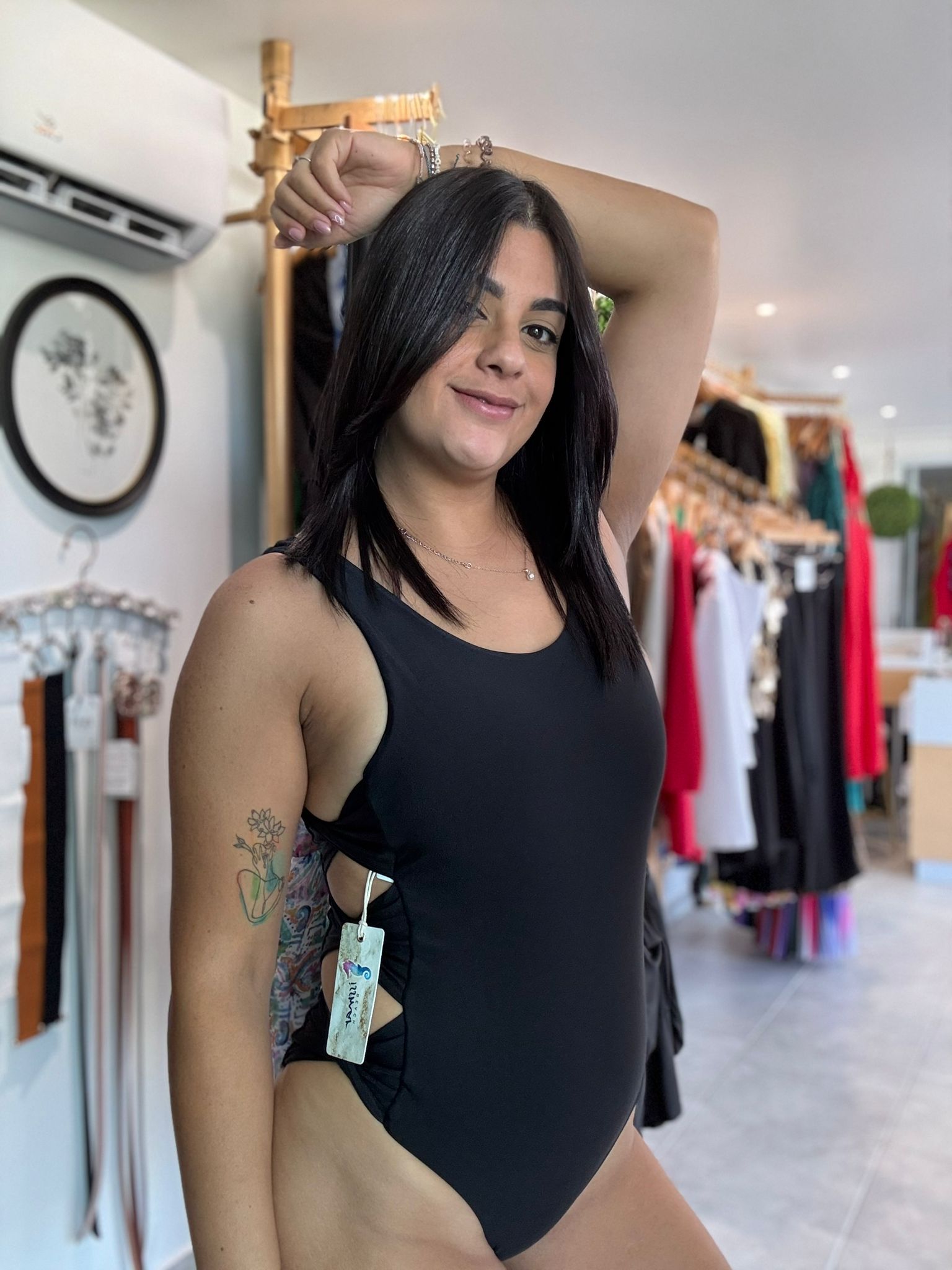 Solid color swimsuit crossed at the sides